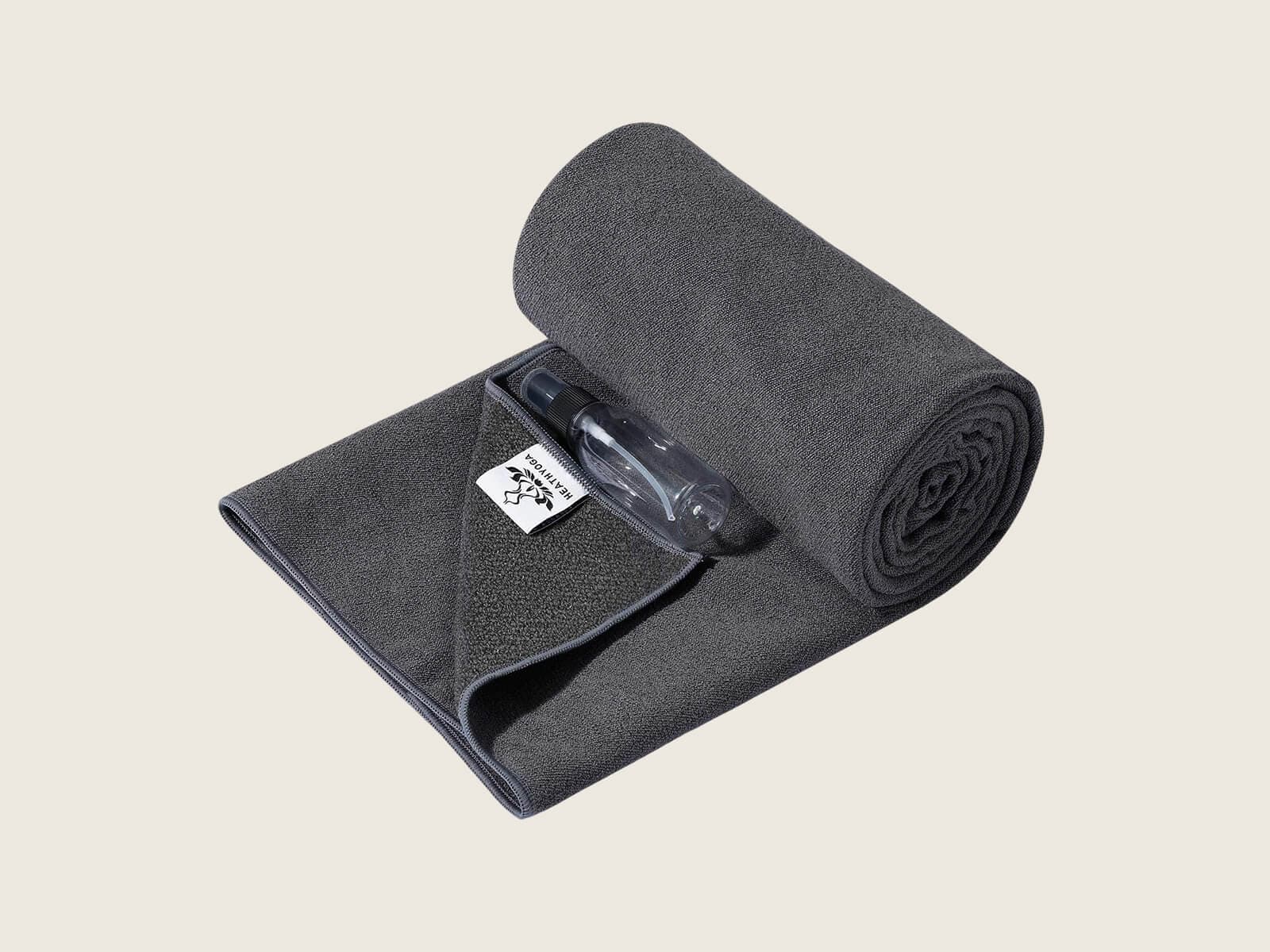 Heathyoga hot yoga towel showing silicone grip backing and spray bottle